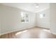 Bright bedroom with hardwood floors and two windows, creating a serene atmosphere at 4682 Chatham St, Boulder, CO 80301