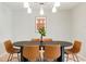 Modern dining room featuring a stylish oval table and unique chandelier lighting at 4682 Chatham St, Boulder, CO 80301