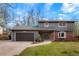 Charming two-story home with a well-manicured lawn, brick accents, and a two-car garage at 4682 Chatham St, Boulder, CO 80301