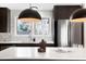 Bright kitchen featuring stainless steel appliances, a large island, and natural light at 4682 Chatham St, Boulder, CO 80301