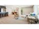 Open-concept living room features modern furnishings, light wood floors and dining area for seamless entertaining at 4682 Chatham St, Boulder, CO 80301