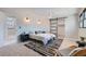 Comfortable main bedroom with a sliding barn door, modern lighting and carpet flooring at 4682 Chatham St, Boulder, CO 80301