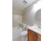 Clean bathroom with tub, toilet, and vanity with wood cabinets at 1120 Cholla Ln, Broomfield, CO 80020