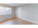 Simple bedroom with hardwood floors and a window with blinds at 1120 Cholla Ln, Broomfield, CO 80020
