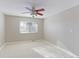 Well-lit bedroom with ceiling fan and window at 1120 Cholla Ln, Broomfield, CO 80020