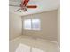 Bright bedroom with ceiling fan and window blinds at 1120 Cholla Ln, Broomfield, CO 80020