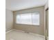 Bedroom featuring a large window with blinds at 1120 Cholla Ln, Broomfield, CO 80020