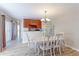Dining area with hardwood floors, chandelier, and access to patio at 1120 Cholla Ln, Broomfield, CO 80020