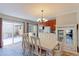 Dining area with hardwood floors, chandelier, and access to patio at 1120 Cholla Ln, Broomfield, CO 80020