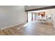 Bright dining room with hardwood floors and view into kitchen at 1120 Cholla Ln, Broomfield, CO 80020