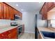 Kitchen with stainless steel appliances and wood cabinets at 1120 Cholla Ln, Broomfield, CO 80020