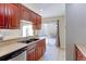 Kitchen with double sink, stainless steel appliances, and patio access at 1120 Cholla Ln, Broomfield, CO 80020
