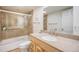 Bathroom showcasing a glass shower, granite countertop vanity, and ample storage for toiletries and bath essentials at 8893 W Ontario Ave, Littleton, CO 80128