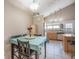 Cozy dining area adjacent to the kitchen, perfect for casual meals and entertaining guests at 8893 W Ontario Ave, Littleton, CO 80128