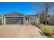 Charming single-Gathering home features a well-maintained yard and an attached two-car garage at 8893 W Ontario Ave, Littleton, CO 80128