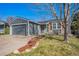 Charming single-Gathering home features a well-maintained yard and an attached two-car garage at 8893 W Ontario Ave, Littleton, CO 80128