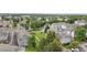 An aerial view showcases the beautiful townhome community and manicured green space at 4070 E 119Th Pl # B, Thornton, CO 80233