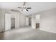 Bedroom featuring carpet, neutral walls, and doors to the closet and bathroom at 4070 E 119Th Pl # B, Thornton, CO 80233