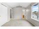 Vaulted bedroom featuring a large window, and access to bathroom at 4070 E 119Th Pl # B, Thornton, CO 80233