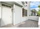 Inviting front entrance with gray siding, white trim, and a charming covered porch at 4070 E 119Th Pl # B, Thornton, CO 80233