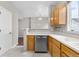 Bright kitchen featuring modern stainless-steel appliances, light-colored countertops, and wooden cabinetry at 4070 E 119Th Pl # B, Thornton, CO 80233