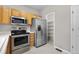 Well-equipped kitchen featuring stainless steel appliances and an adjacent pantry at 4070 E 119Th Pl # B, Thornton, CO 80233