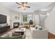 Comfortable living room showcasing a fireplace, neutral tones and large windows at 4070 E 119Th Pl # B, Thornton, CO 80233