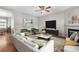 Bright living room featuring a fireplace, ceiling fan, and an entertainment center at 4070 E 119Th Pl # B, Thornton, CO 80233