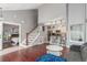 View of open concept first floor featuring the living room, dining area, kitchen and staircase at 8360 W 87Th Dr # D, Arvada, CO 80005