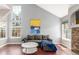 Bright and airy living room with high ceilings, large windows, and comfortable seating at 8360 W 87Th Dr # D, Arvada, CO 80005