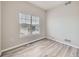 This bedroom is ready for personalization with its neutral paint and gray, wood-look floors at 9363 Amison Cir # 106, Parker, CO 80134