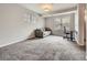 Cozy bedroom with neutral carpet, a comfortable daybed, and a bright window view at 9363 Amison Cir # 106, Parker, CO 80134