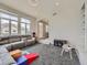 Comfortable living room with carpeted floors and lots of natural light; a perfect space for relaxation at 9363 Amison Cir # 106, Parker, CO 80134