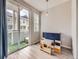 Playroom with natural light, featuring a table, chairs, blue cabinet and sliding glass doors to balcony at 9363 Amison Cir # 106, Parker, CO 80134