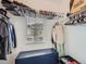 Walk-in closet with ample storage, hanging racks, and a window with neighborhood views at 9363 Amison Cir # 106, Parker, CO 80134