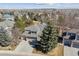 This is an aerial view of a lovely home in a treed neighborhood, with a large manicured yard and a welcoming driveway at 16302 Parkside Dr, Parker, CO 80134