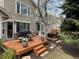 A two-level wooden back deck with outdoor furniture and a barbeque grill at 16302 Parkside Dr, Parker, CO 80134
