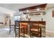 Charming finished basement with a full bar, rustic finishes, and ample seating at 16302 Parkside Dr, Parker, CO 80134