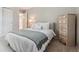 Comfortable bedroom with soft carpet, stylish decor, and natural light at 16302 Parkside Dr, Parker, CO 80134