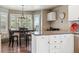Bright dining area with a black dining set next to a countertop workstation at 16302 Parkside Dr, Parker, CO 80134