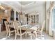 Elegant dining room with a stylish chandelier, a large dining table, and a lovely china cabinet, perfect for Gathering dinners at 16302 Parkside Dr, Parker, CO 80134