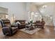 Spacious living room with hardwood floors, high ceilings, and a comfortable seating area, great for Gathering gatherings at 16302 Parkside Dr, Parker, CO 80134