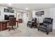 Finished basement living area with comfortable seating, a desk, and ample space at 16302 Parkside Dr, Parker, CO 80134