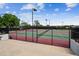 Well-maintained tennis courts surrounded by a black fence, set in a recreational area at 16302 Parkside Dr, Parker, CO 80134