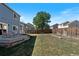 Great view of a sizable backyard with a well-maintained lawn and patio at 4947 Stoneham Ave, Castle Rock, CO 80104