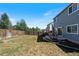 Large backyard features a spacious lawn and a fenced perimeter for privacy at 4947 Stoneham Ave, Castle Rock, CO 80104