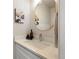 Modern half-bathroom vanity with a quartz countertop, stylish mirror, and decorative accents at 4947 Stoneham Ave, Castle Rock, CO 80104