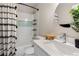 Bright bathroom features a shower with a tub and white vanity with quartz countertop at 4947 Stoneham Ave, Castle Rock, CO 80104