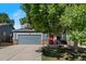 Charming two-story home with a gray exterior, red shutters, and a well-manicured lawn at 4947 Stoneham Ave, Castle Rock, CO 80104