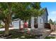 View of a charming home featuring a porch with bench seating, a tree providing shade, and a well-maintained front yard at 4947 Stoneham Ave, Castle Rock, CO 80104